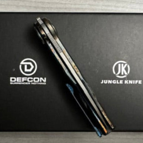 Defcon ~ JK Fulcrum ~ M390/Ti Custom Lightning Anodized 1 of 1